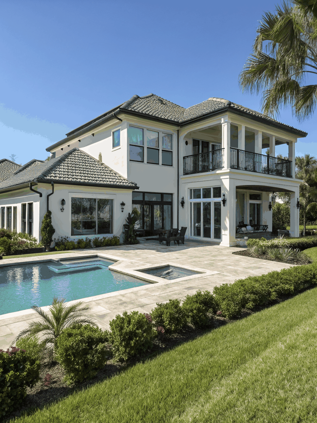 Lake-adjacent residential property with freshly cleaned concrete and siding in Florida