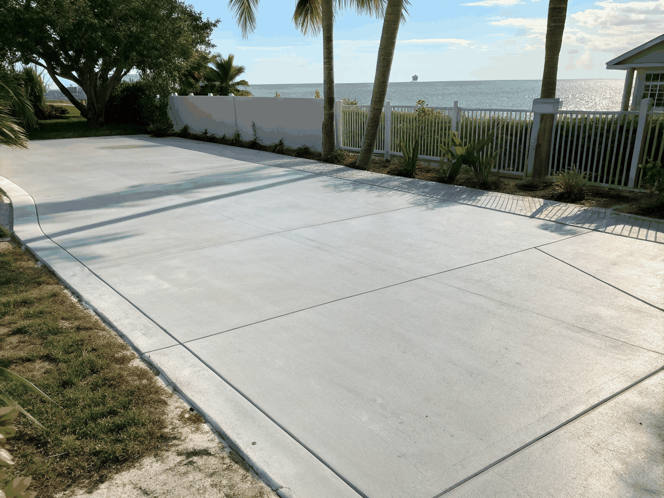 Pressure washing driveway concrete in a sunny St. Cloud Florida neighborhood